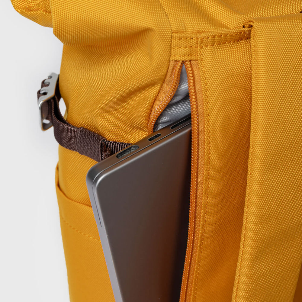 
                      
                        Sandqvist Backpack Rolltop M Icon yellow golden with natural leather
                      
                    